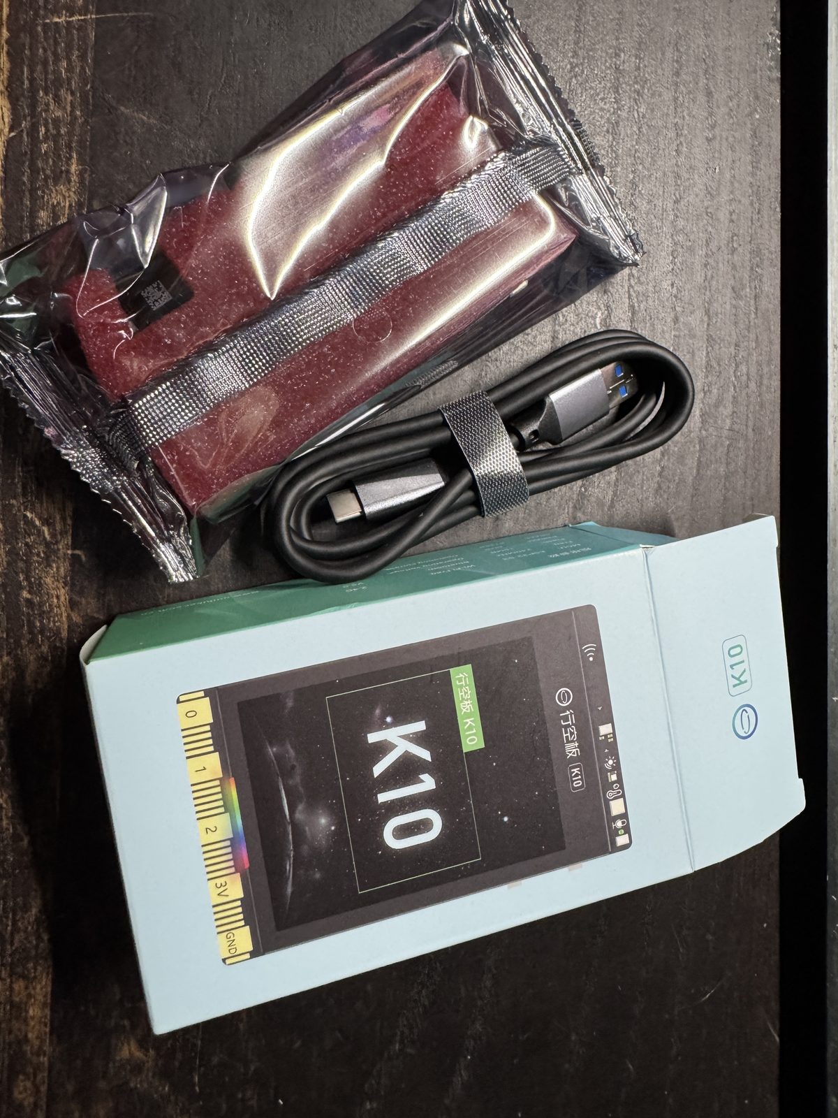 UniHiker K10 unboxing — board, USB-C cable, and packaging