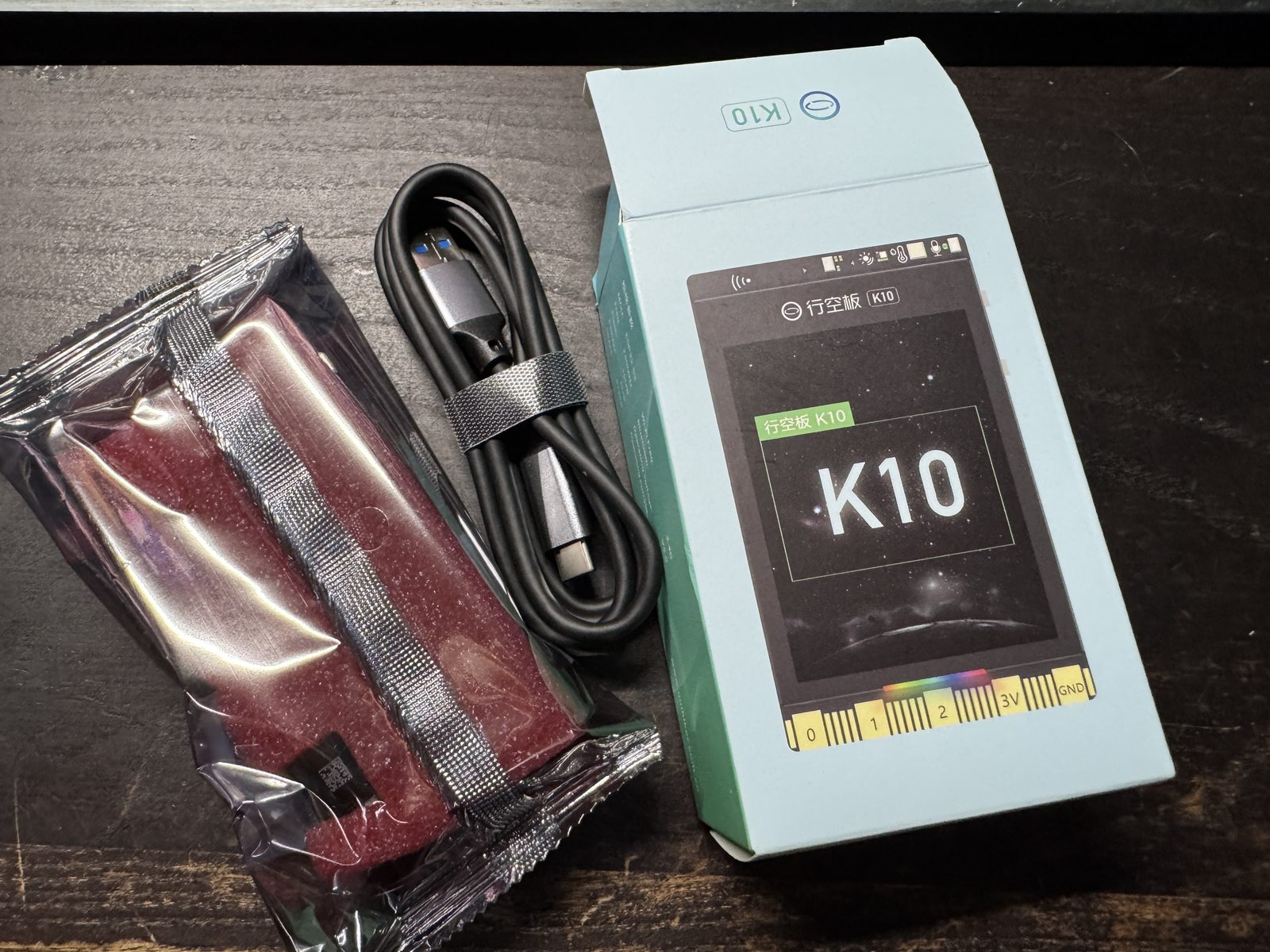 UniHiker K10 unboxing — board, USB-C cable, and packaging